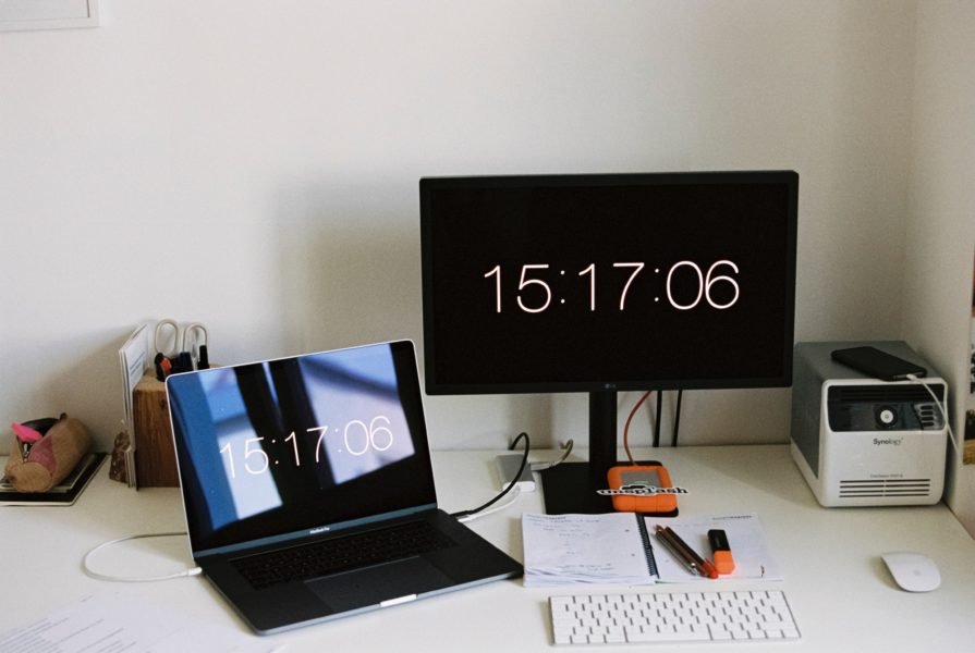 A laptop displaying the time